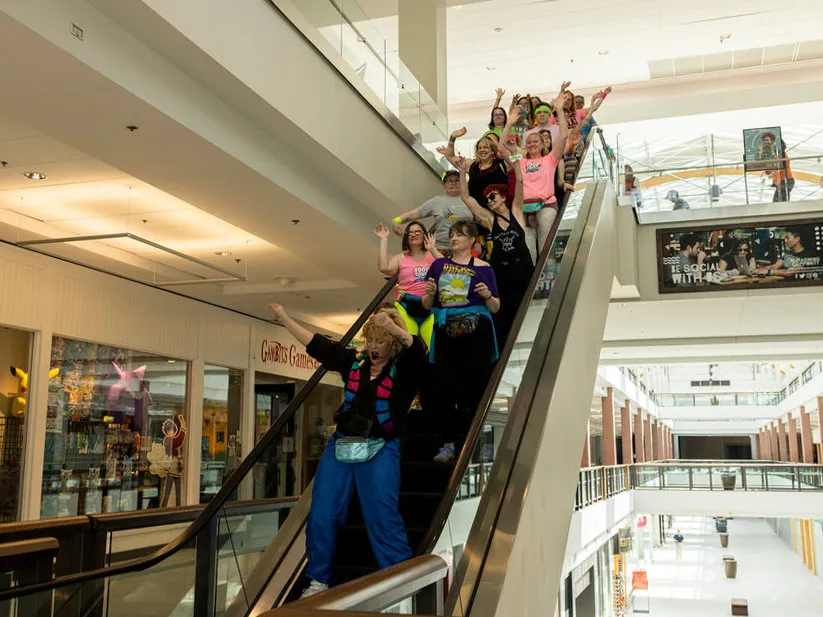 This flashy group of Portland mall walkers puts neon pep into their step 4 Krista Catwood leads the Food Court 5000 mall walkers at the Lloyd Center food court in Portland, Ore.