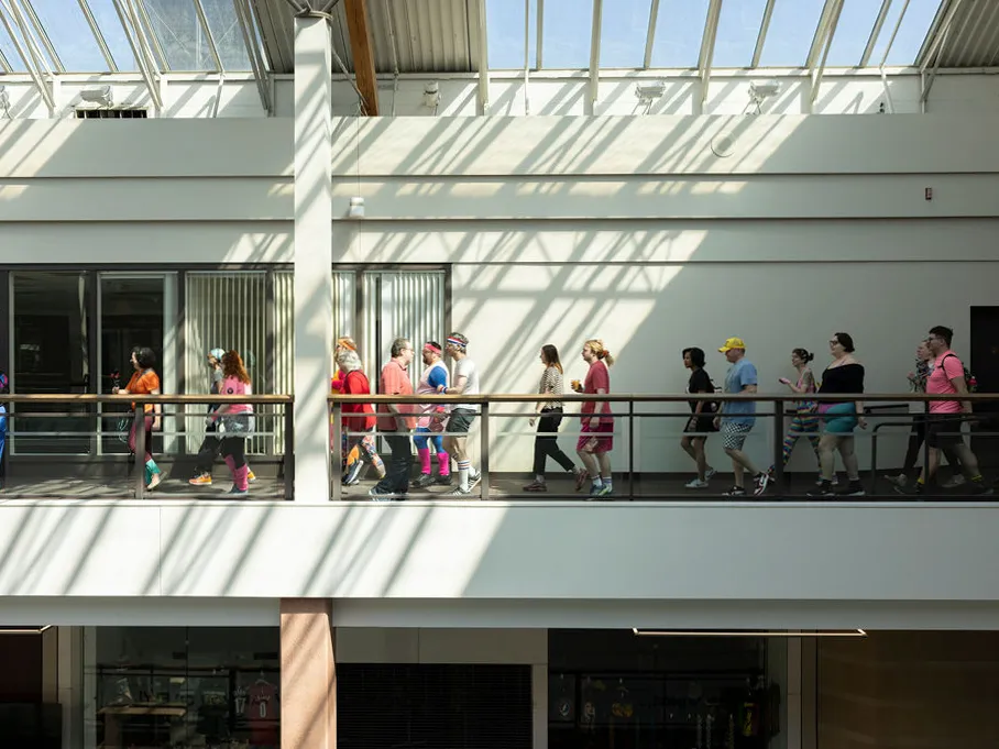 This flashy group of Portland mall walkers puts neon pep into their step 5 The Food Court 5000 participants walk along the top floor of the Lloyd Center.