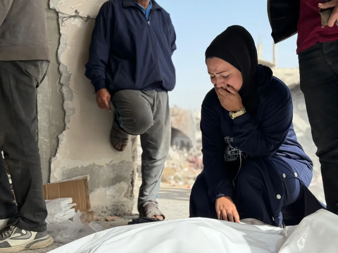 Skeletons in their clothing: Recovering bodies from the rubble in Gaza 7 Ola Abu Naser grieves over the body of her 16-year-old brother Imad, recovered from the rubble of their apartment building destroyed in an Israeli strike in October 2024 in Beit Lahia, Gaza.