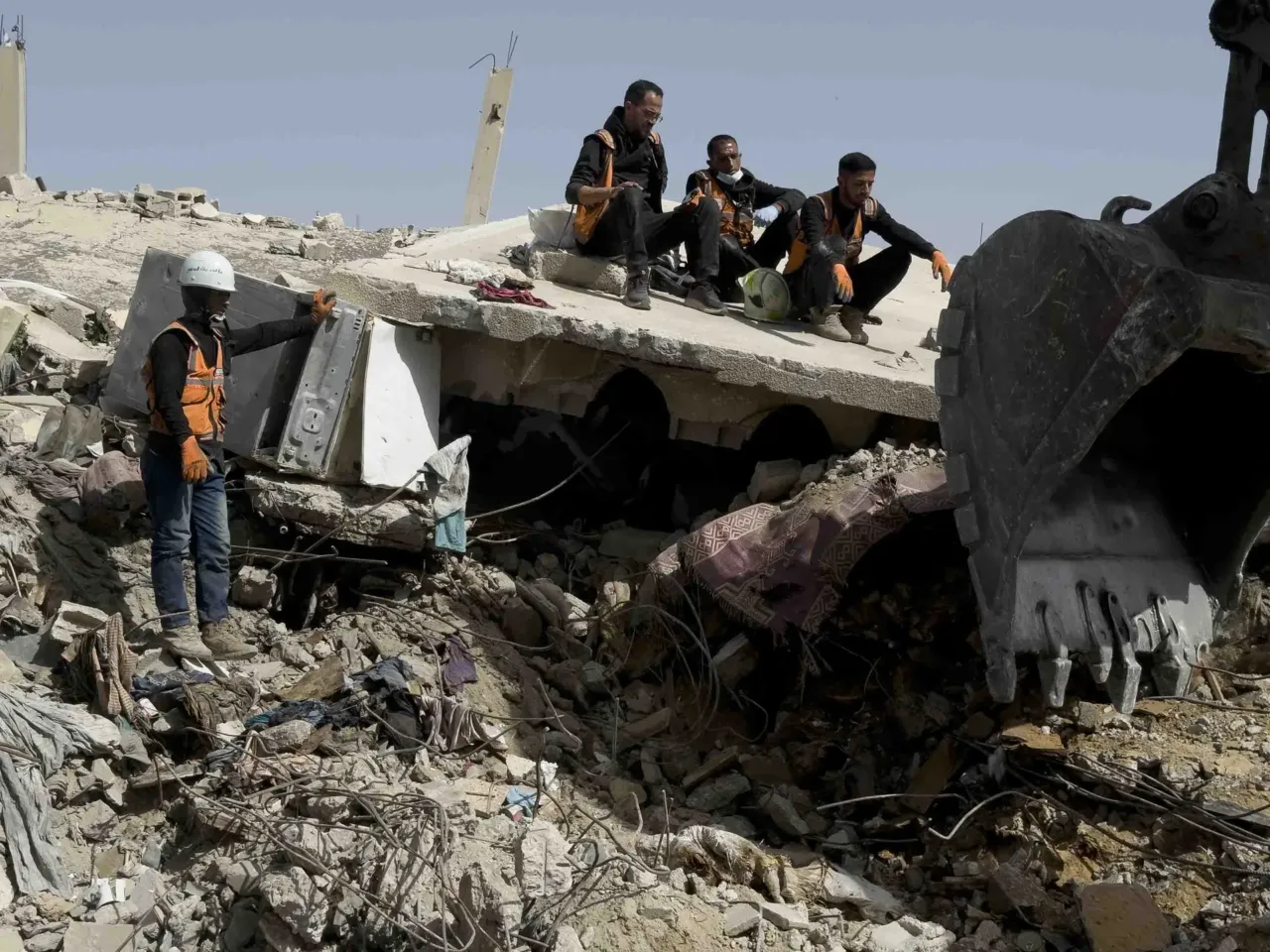 Skeletons in their clothing: Recovering bodies from the rubble in Gaza 3 Gaza civil defense crew members search beneath the rubble of the Abu Naser family home, which was targeted by Israel's military in October 2024, in one of the deadliest Israeli strikes of the Gaza war.