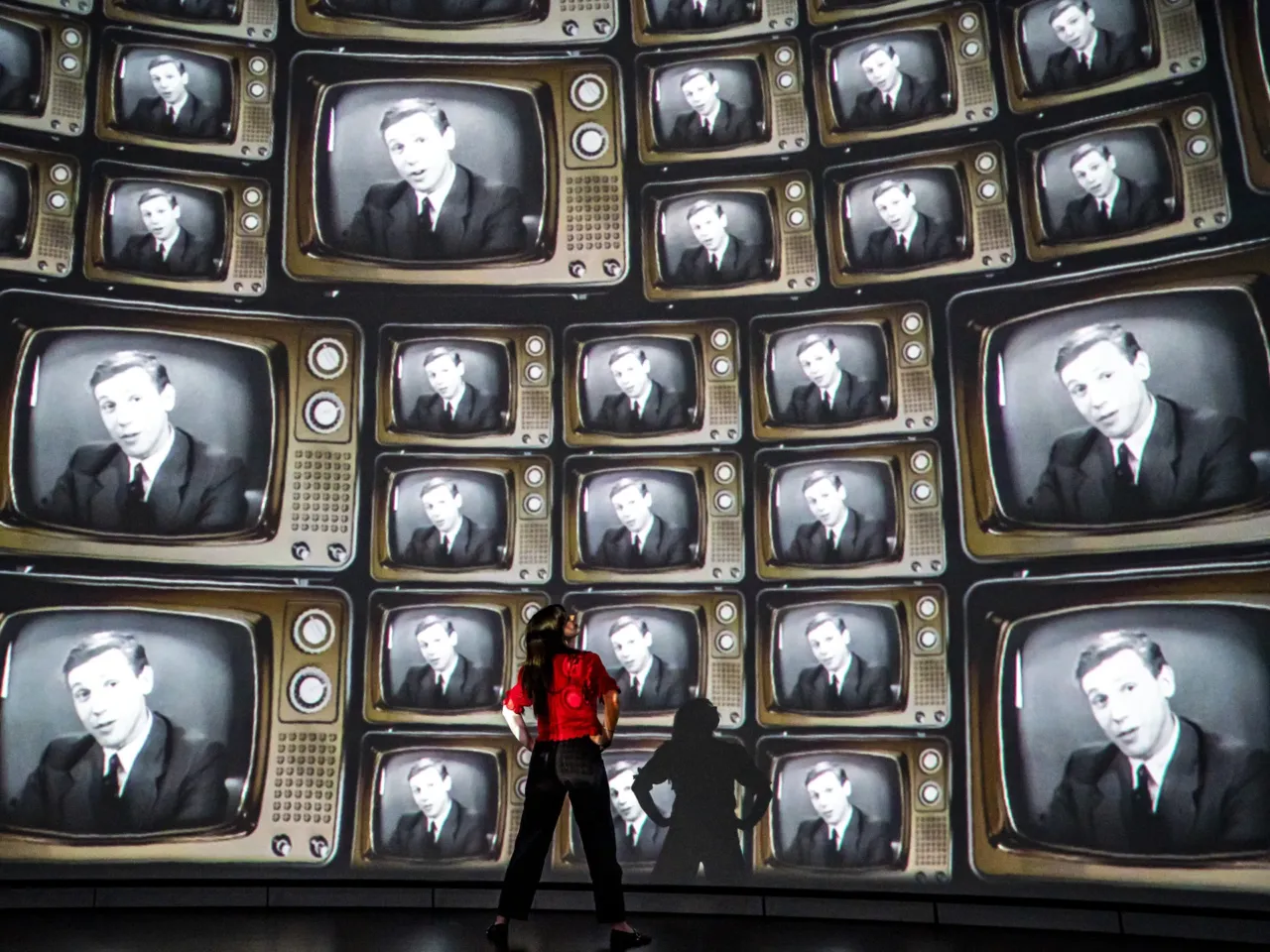 David Attenborough celebrates his 100th birthday 1 Head of creative enterprise, Maddie Hall, watches hundreds of television screens with David Attenborough's face, from when he was a young broadcaster, projected inside the dome within the Market Hall at Real Ideas in Devonport, Plymouth, England, where Hall and her team are making preparations for a public release of an immersive film to mark Attenborough's 100th birthday on Friday.