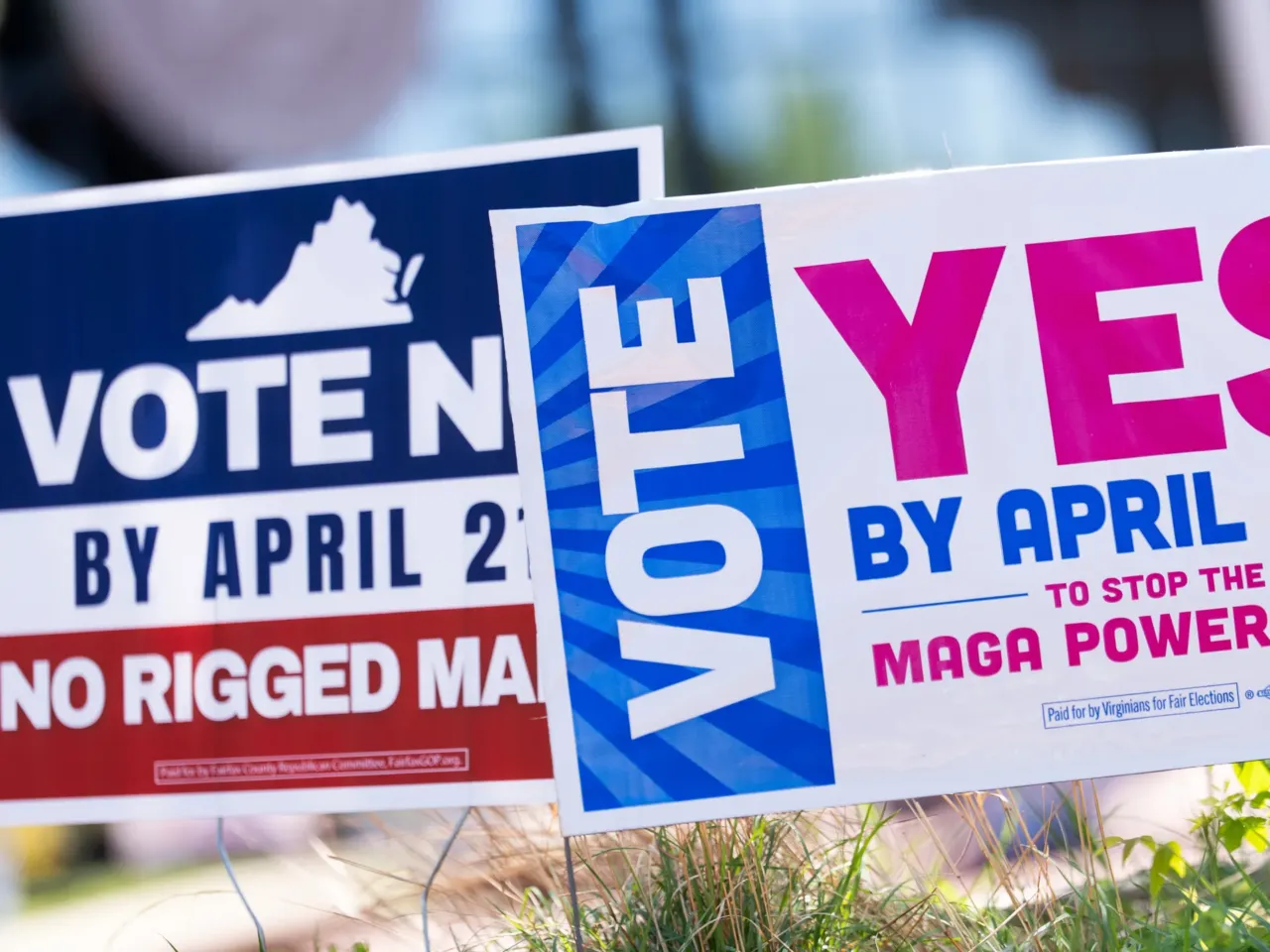 Signs are seen during the Virginia redistricting referendum on April 21 in Fairfax, Va.