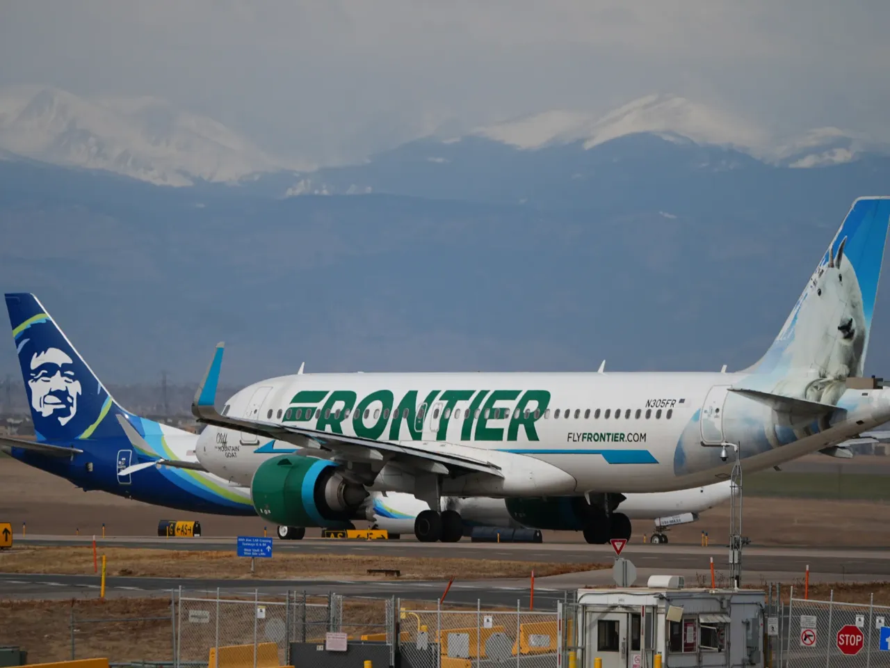 A Frontier Airlines jetliner waits for clearance to take off as high winds strafe Denver International Airport Thursday, March 12, 2026, in Denver.