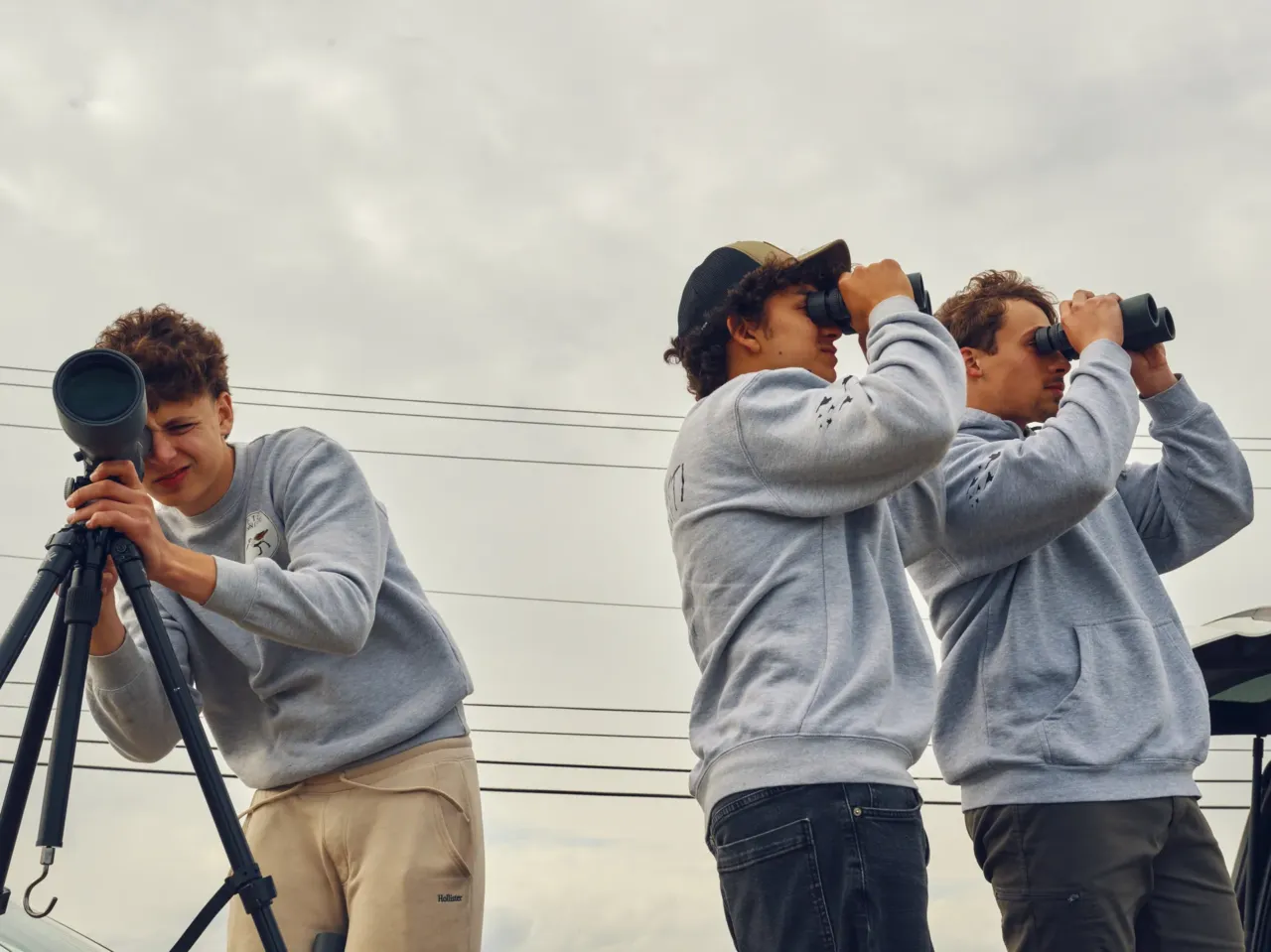 24 hours with 3 teenage birders: Welcome to the World Series of Birding 6 Train (left), Pacetti and Trojan look through a scope and binoculars at Malibu Beach Wildlife Management Area.
