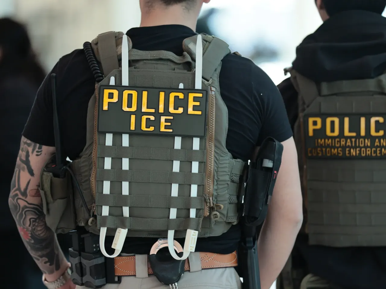 The economic chilling effect of Trump's immigration crackdown 1 NEW YORK, NEW YORK - MARCH 24: Immigration and Customs Enforcement (ICE) agents patrol Terminal C at LaGuardia Airport on March 24, 2026 in New York, New York.