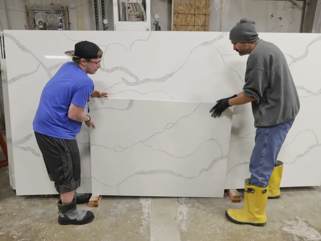 How a CEO and Trump donor is weaponizing tariffs against his rivals 1 Workers move imported quartz slabs from China in the warehouse at Marble Uniques in Tipton, Ind., in 2019.