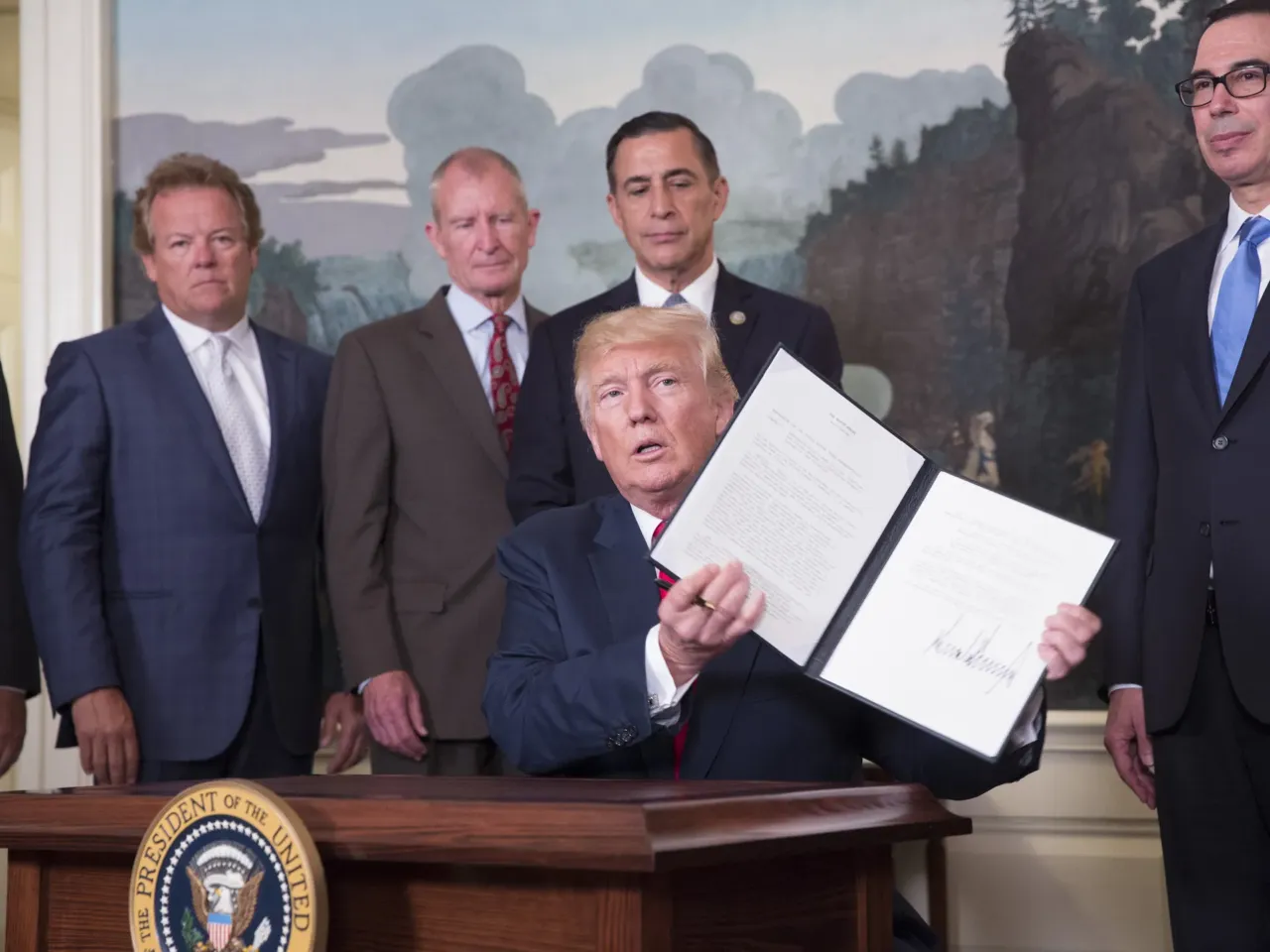 How a CEO and Trump donor is weaponizing tariffs against his rivals 2 President Trump signs a memorandum on addressing China's laws, policies, practices, and actions related to intellectual property, innovation, and technology at The White House in 2017. Davis (left) attended the signing.