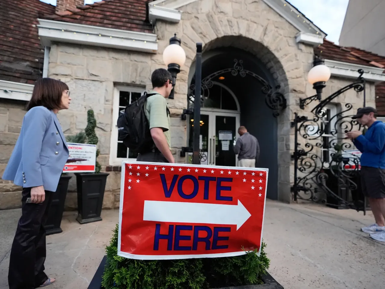 People wait in a line at a precinct before voting during a Georgia primary.
