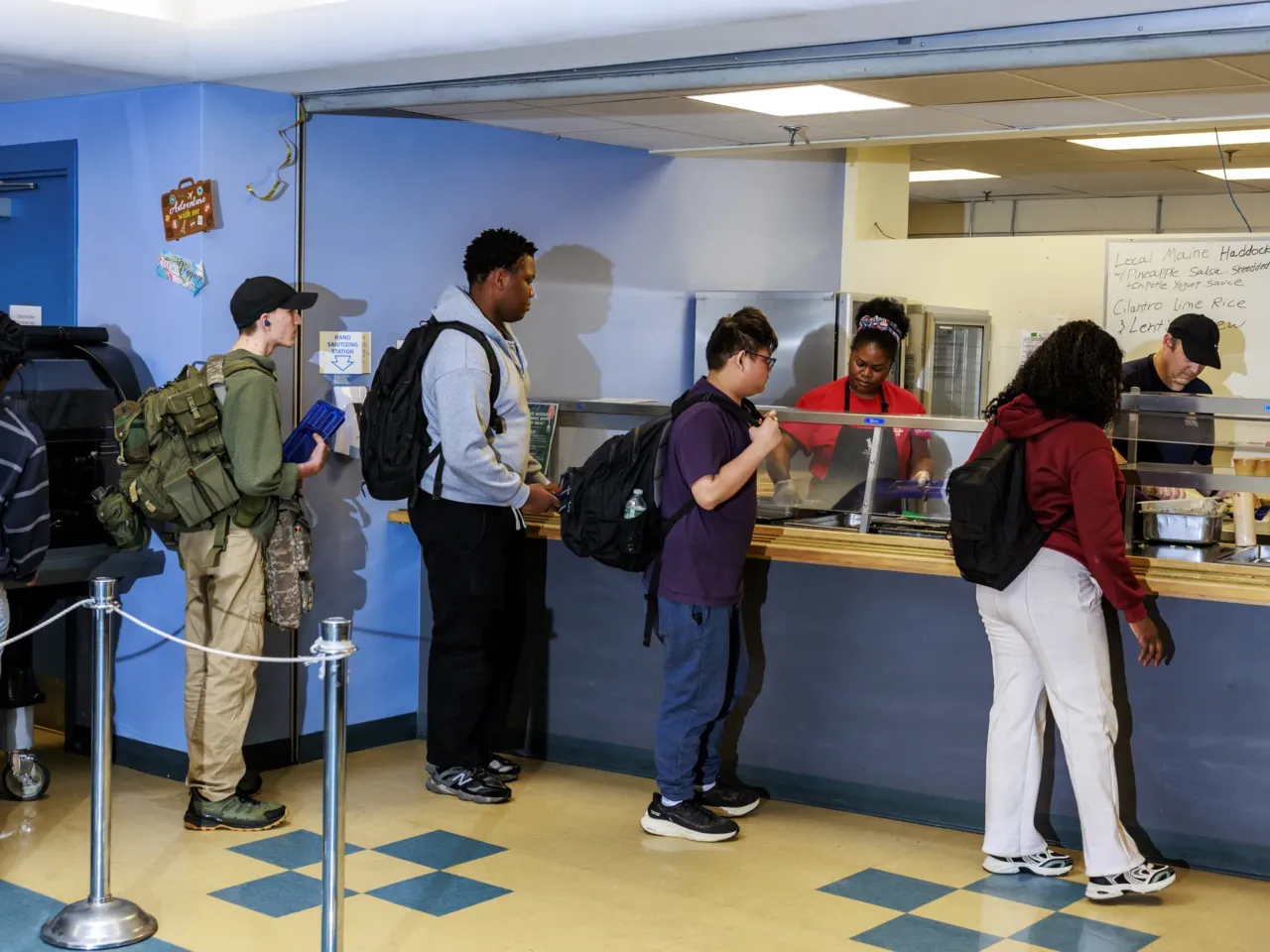 One solution for Maine's struggling fishing industry? Give fillets away for free 4 Westbrook High School students wait in line for lunch.