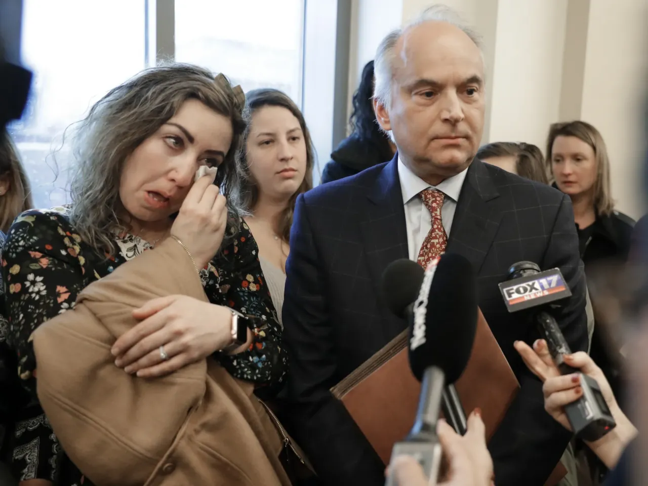 RaDonda Vaught and her attorney, Peter Strianse, talk with reporters after a court hearing on Feb. 20, 2019, in Nashville, Tenn.