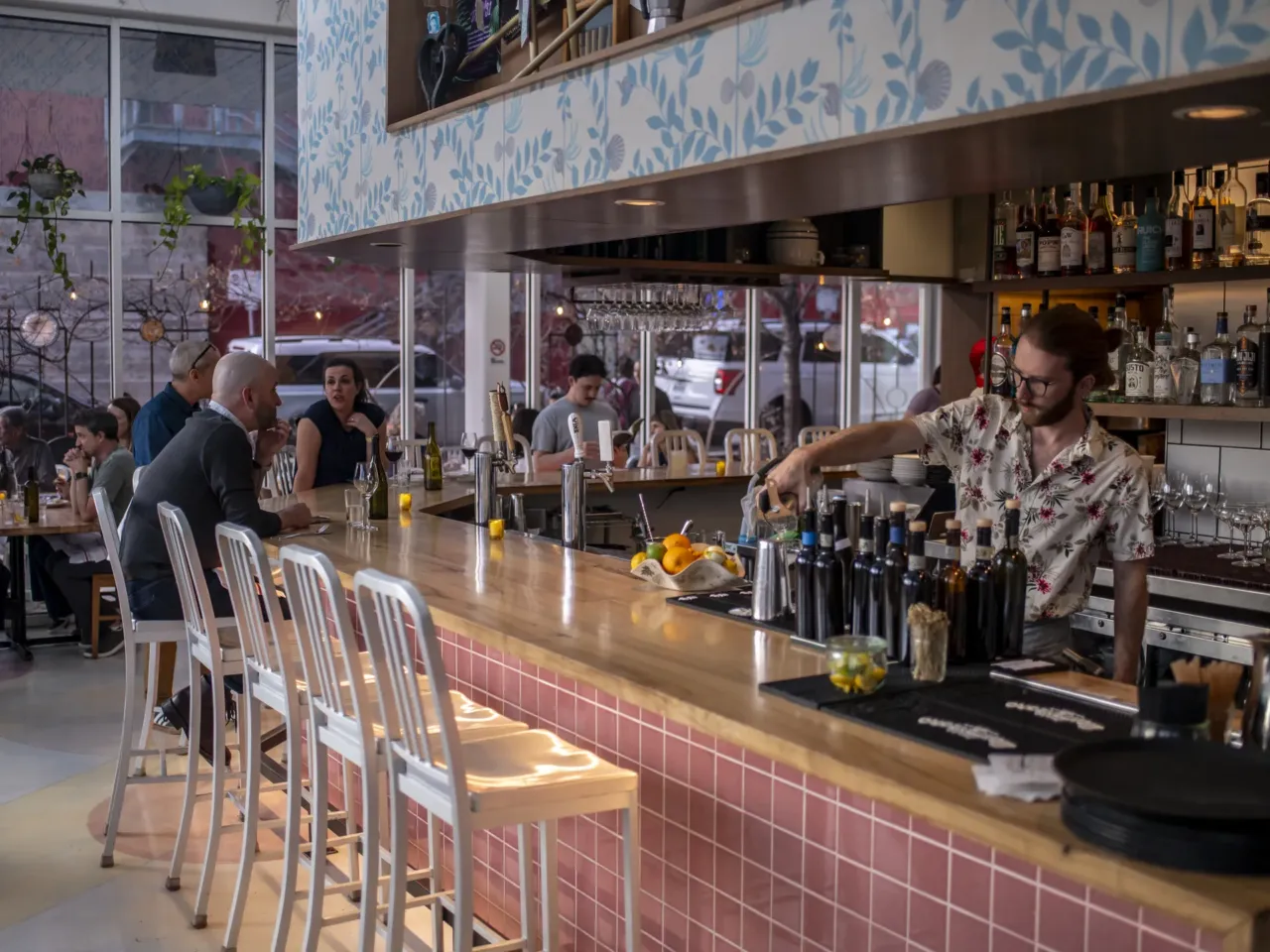 A bartender pours a drink at L'Oca d'Oro, an Italian restaurant in Austin, Texas, that offers a weekly promotion where guests can pay what they want.