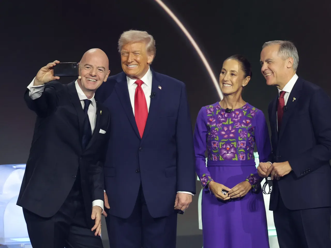 FIFA's World Cup ticket sales outraged fans. Now they are under investigation 1 Infantino poses with President Trump, Mexican President Claudia Sheinbaum, and Canadian Prime Minister Mark Carney at the World Cup draw ceremony held in Washington, D.C., on Dec. 5, 2025.