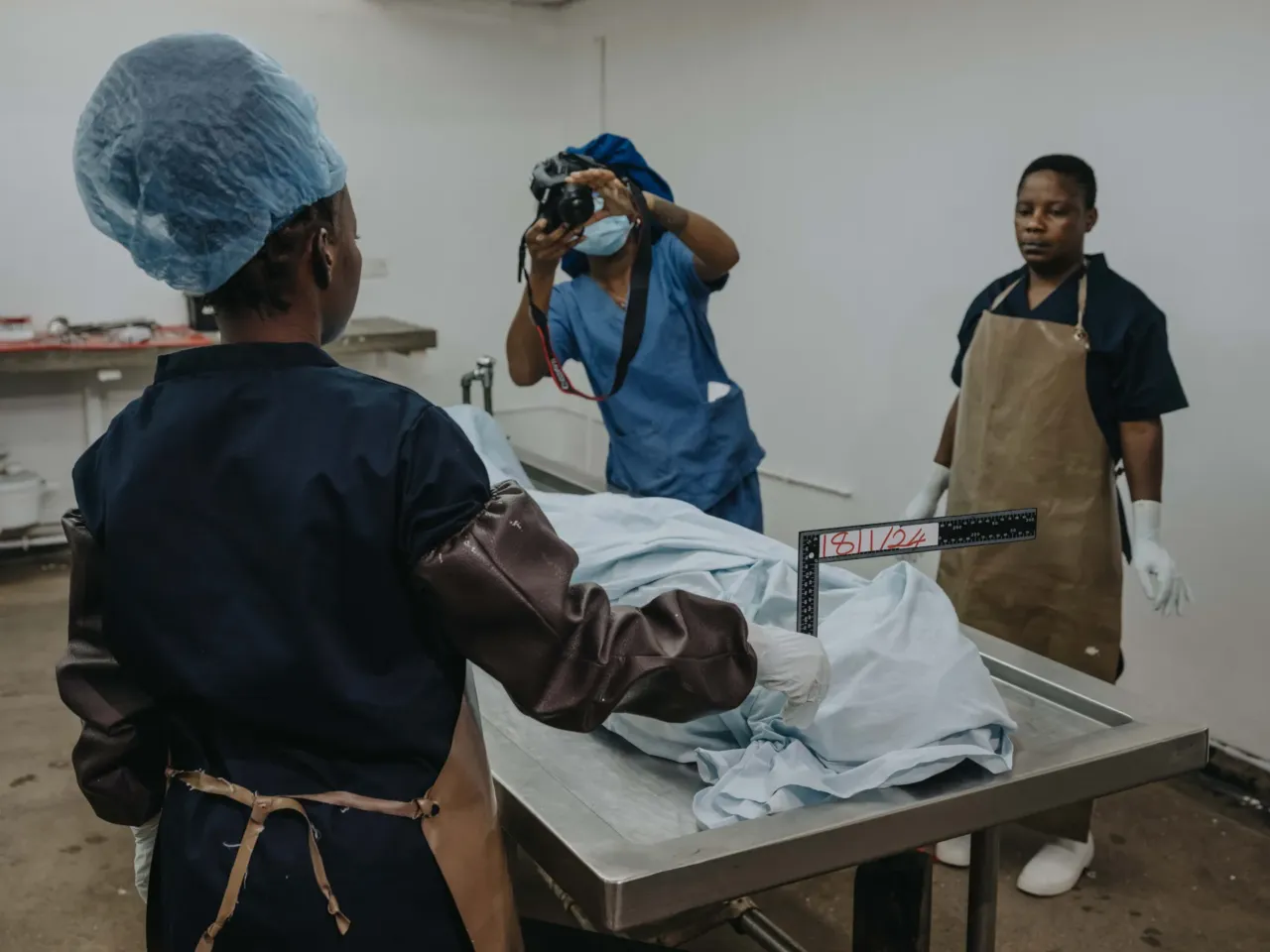 Photos show the world's 'uncounted' people -- and what it takes to be counted 3 November 29, 2024. University Teaching Hospital, Lusaka, Zambia Forensic pathologists and support staff prepare for the day's death investigations. Records of causes of death are critical in establishing priorities for a country's healthcare system.