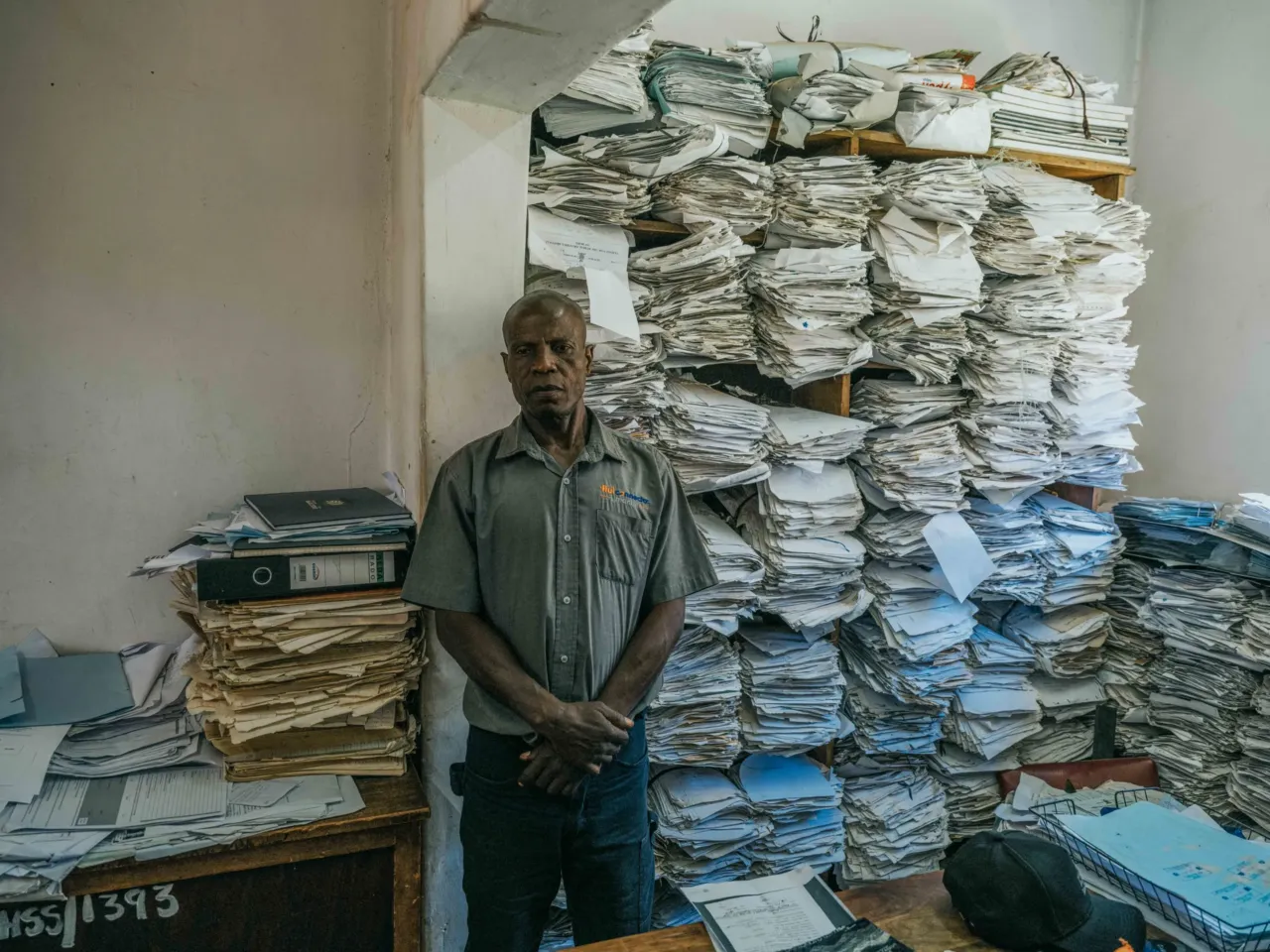 Photos show the world's 'uncounted' people -- and what it takes to be counted 4 December 3, 2024. Death Registration Office, Kitwe, Zambia Lazarus Kangasa waits at the Kitwe City Council Registration Office for a burial permit, the final step in certifying and obtaining his son's death certificate.
