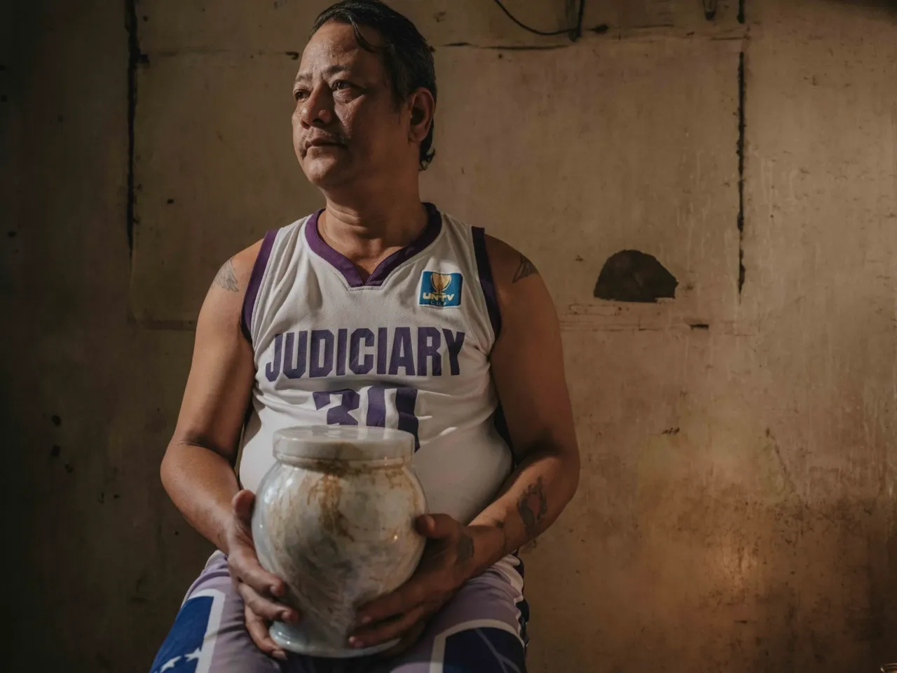 Photos show the world's 'uncounted' people -- and what it takes to be counted 6 February 25, 2025. Quezon City, Philippines Arthur R. Caballero holds the urn containing the ashes of his mother, Erma R. Caballero. The funeral service, provided free of charge, is part of an initiative to support families who cannot afford funeral expenses.
