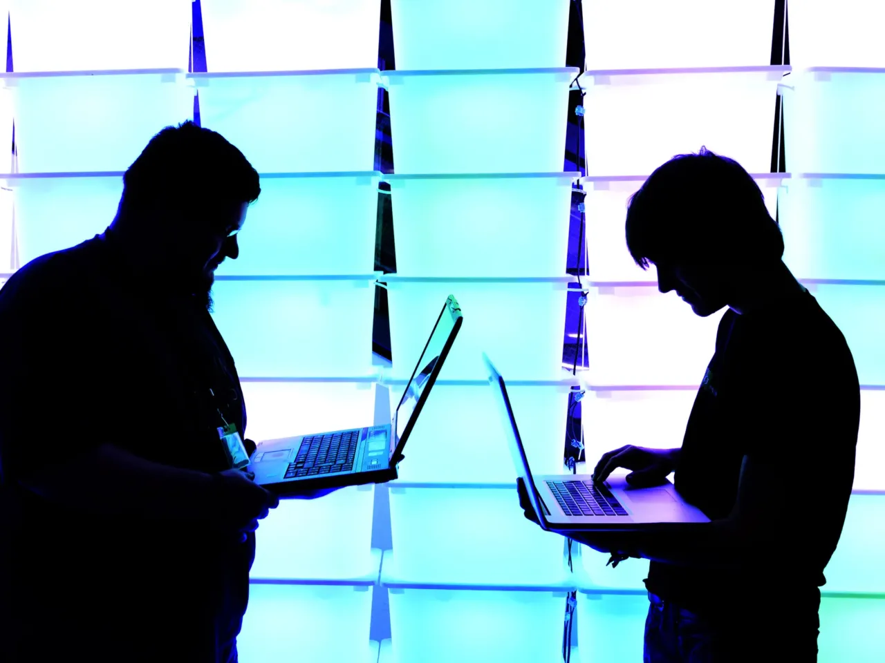 Participants hold their laptops in front of an illuminated wall at the annual Chaos Computer Club (CCC) computer hackers' congress, called 29C3, on December 28, 2012 in Hamburg, Germany. In 2026, open-weight AI models possess advanced capabilities not far behind their proprietary counterparts. Getting rid of open-weight models' guardrails used to take time and deep expertise. But in recent months, that process has become dramatically more accessible and popular.