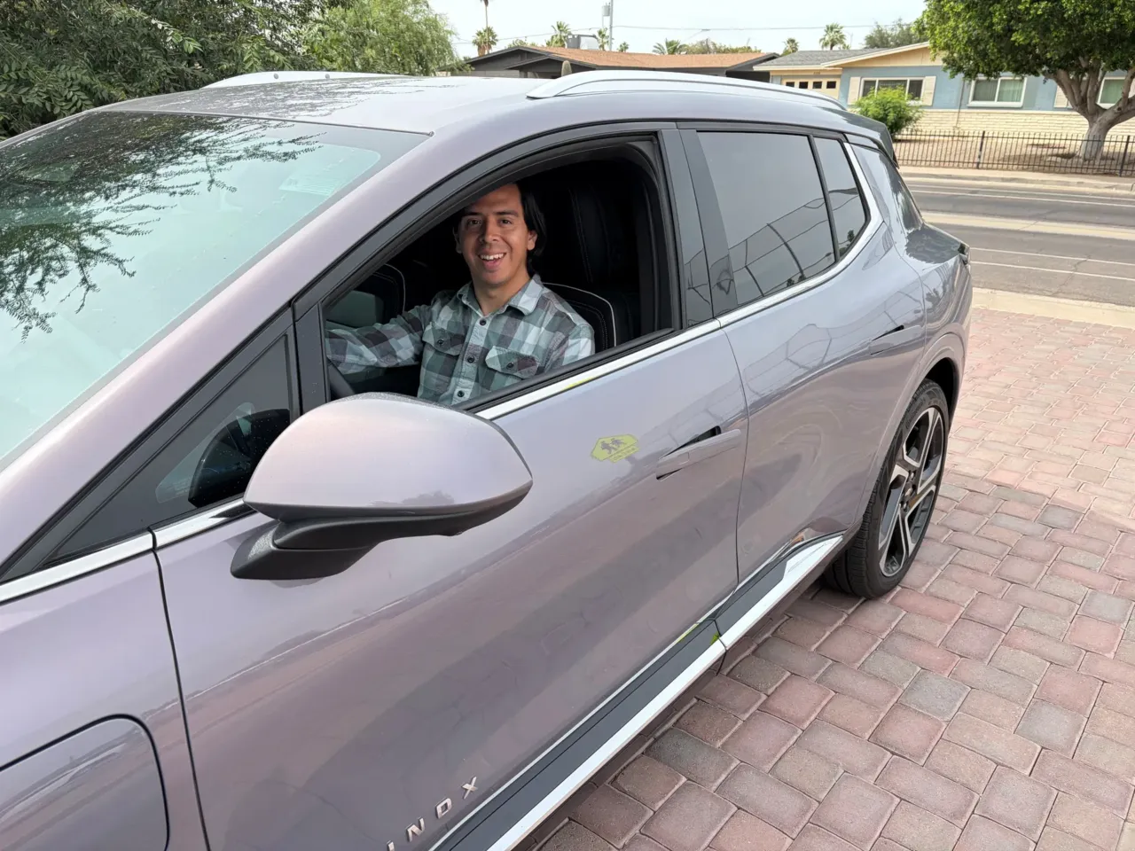 'At what point does it make sense to ditch a gas car for an electric vehicle?' 2 Guadalupe Higuera behind the wheel of his 2025 Chevrolet Equinox EV in Phoenix, Ariz.