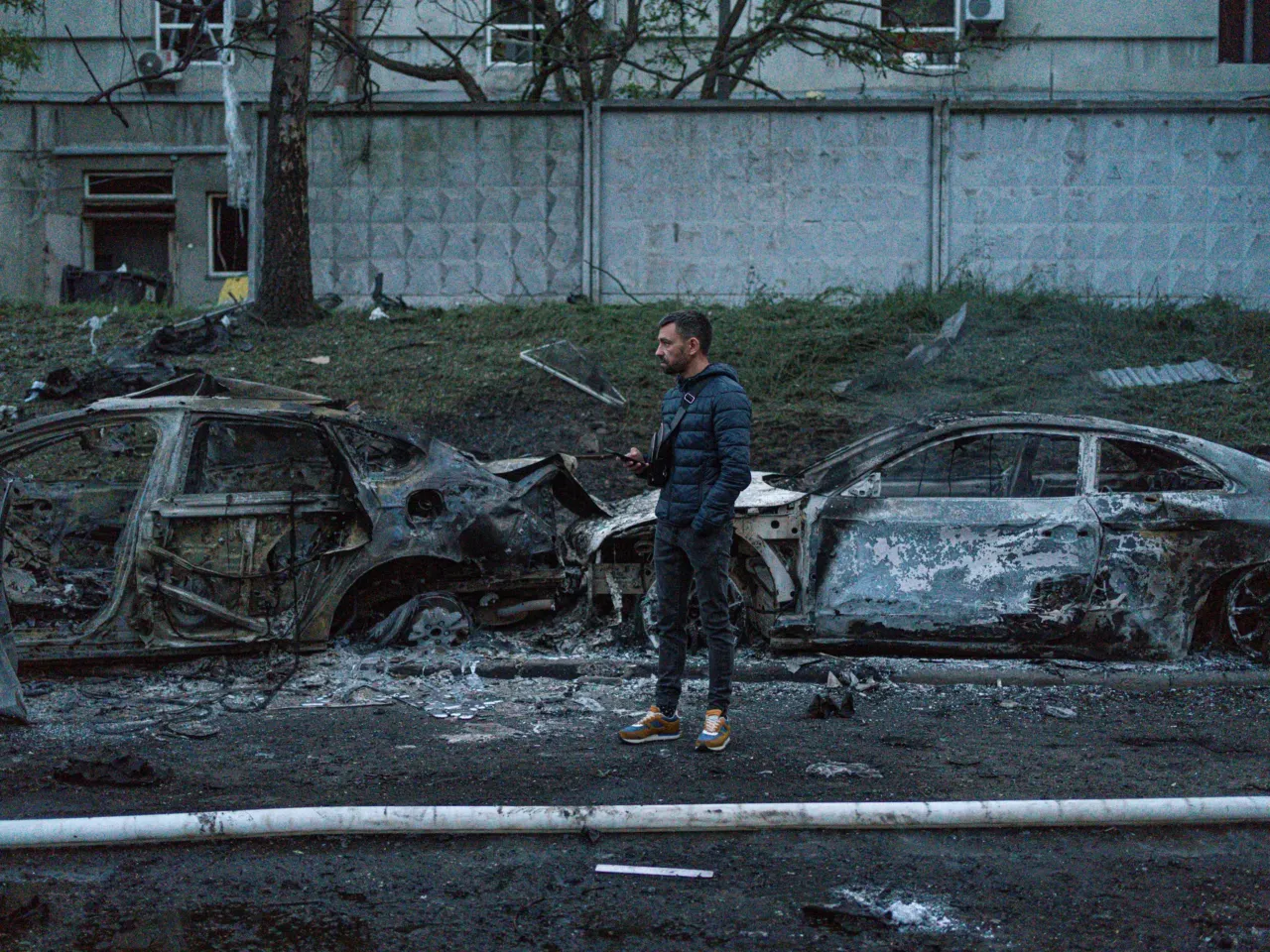 Damage is seen on a Kyiv street after one of Russia's largest aerial assaults on Ukraine in recent months.