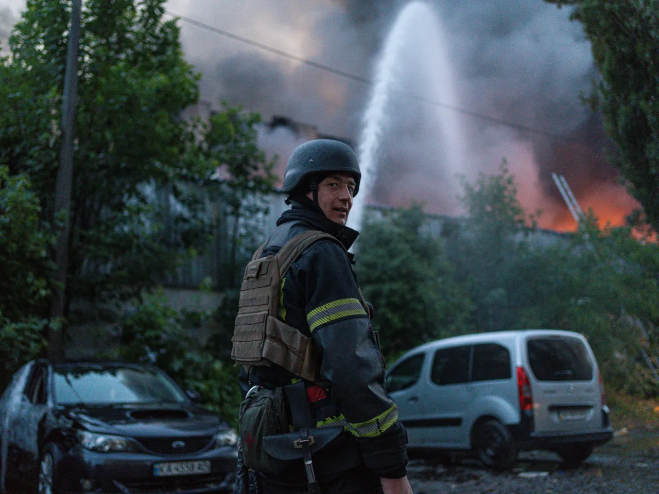 Firefighters put out flames after the attack.