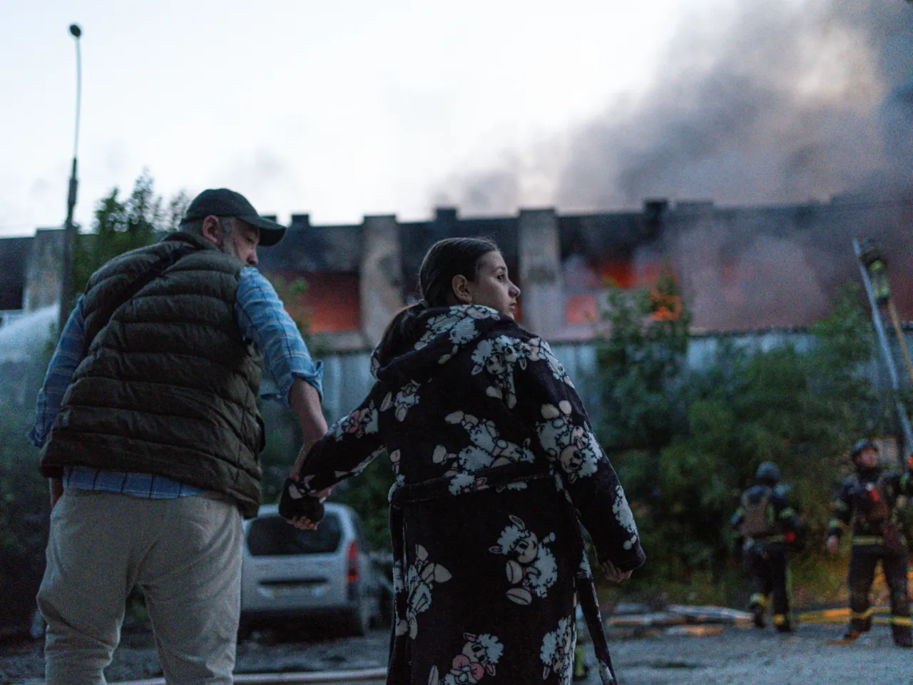 People gather outside after the night attack in Kyiv, Ukraine.
