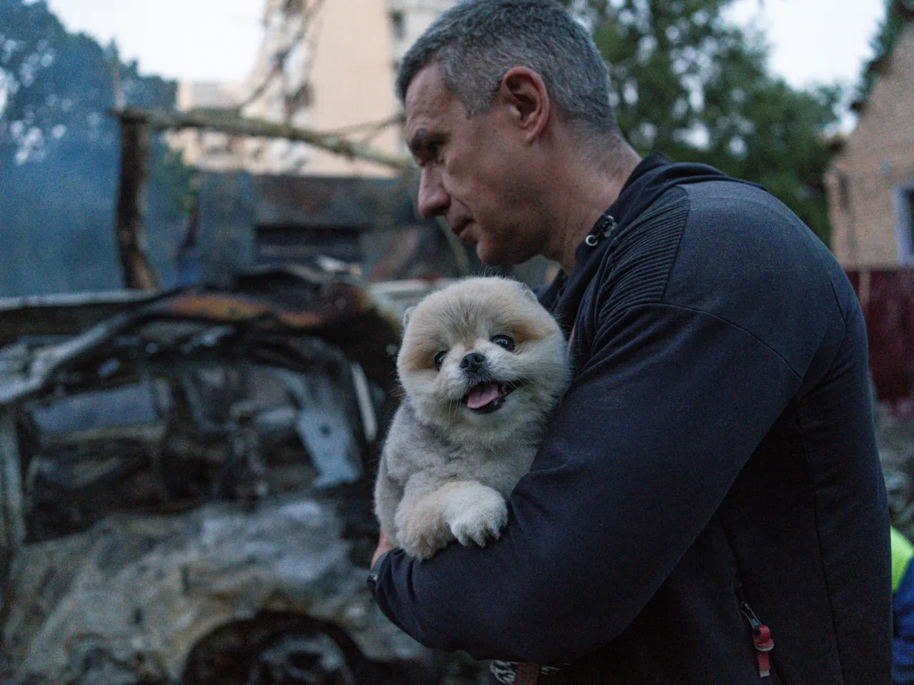 A man carries his dog after the attack on Kyiv, Ukraine on June 2.