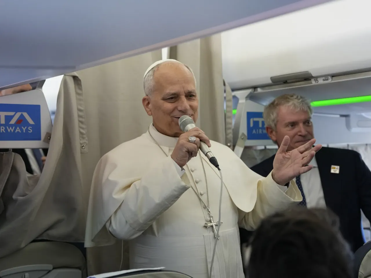 Pope Leo XIV talks to journalists aboard the papal flight from Rome to Madrid on June.