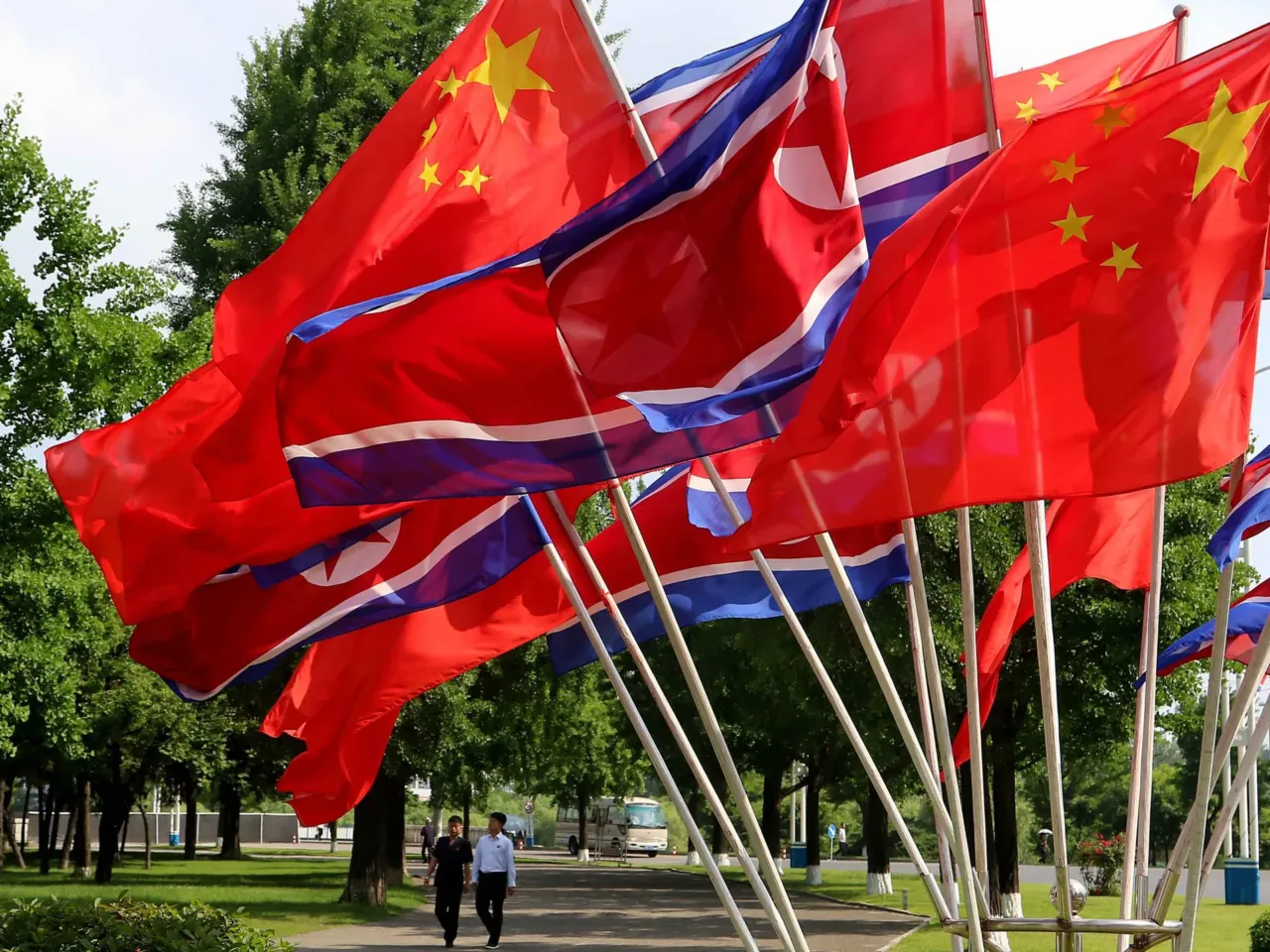 A street is decorated with the flags of China and North Korea in Pyongyang on Monday.