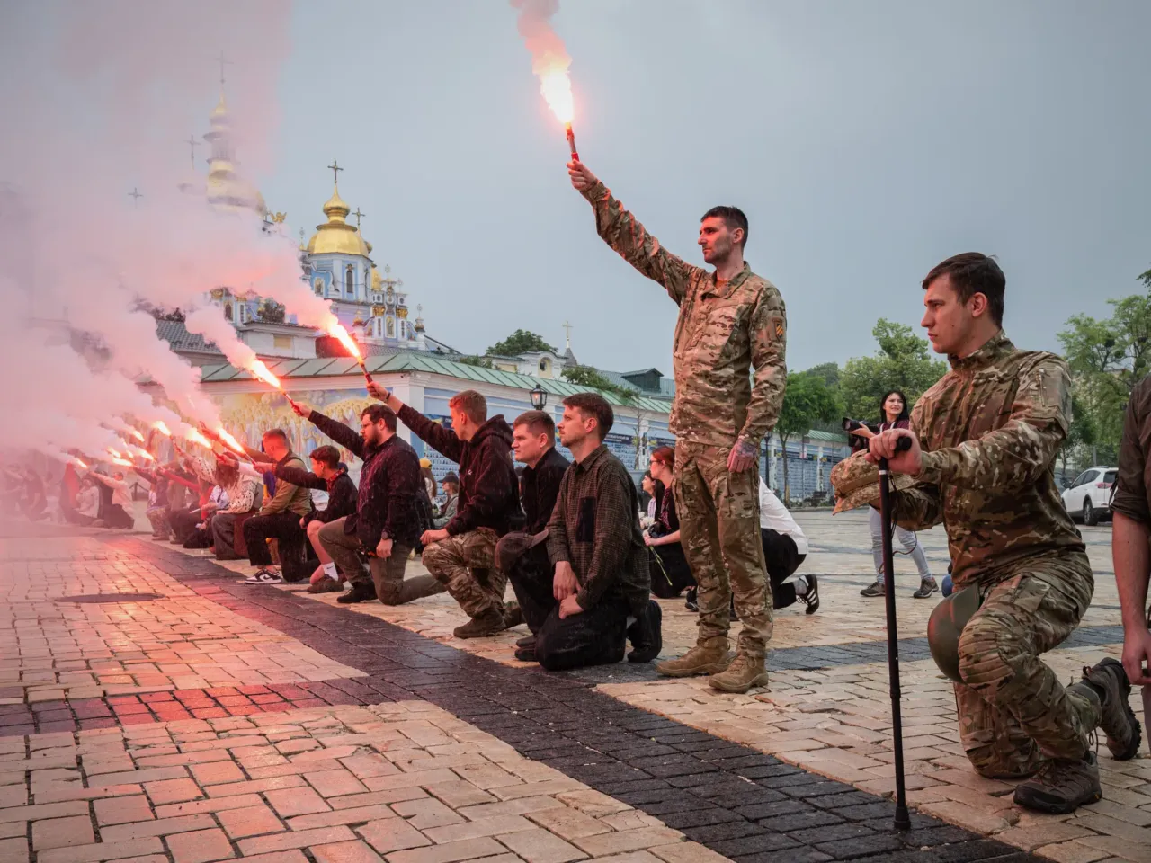 Conflicts are on the rise globally, at the highest level since WWII, data shows 2 People light up flares during the funeral ceremony of fallen Ukrainian serviceman Yaroslav Ivanov in Kyiv, Ukraine, on June 8.