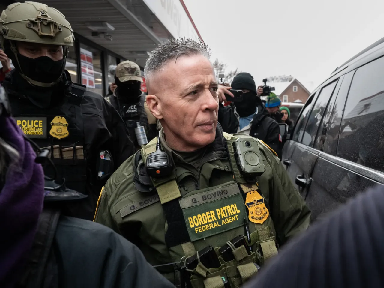 Border Patrol commander Gregory Bovino walks to his vehicle at a gas station in Minneapolis, Minn., on Jan. 21.