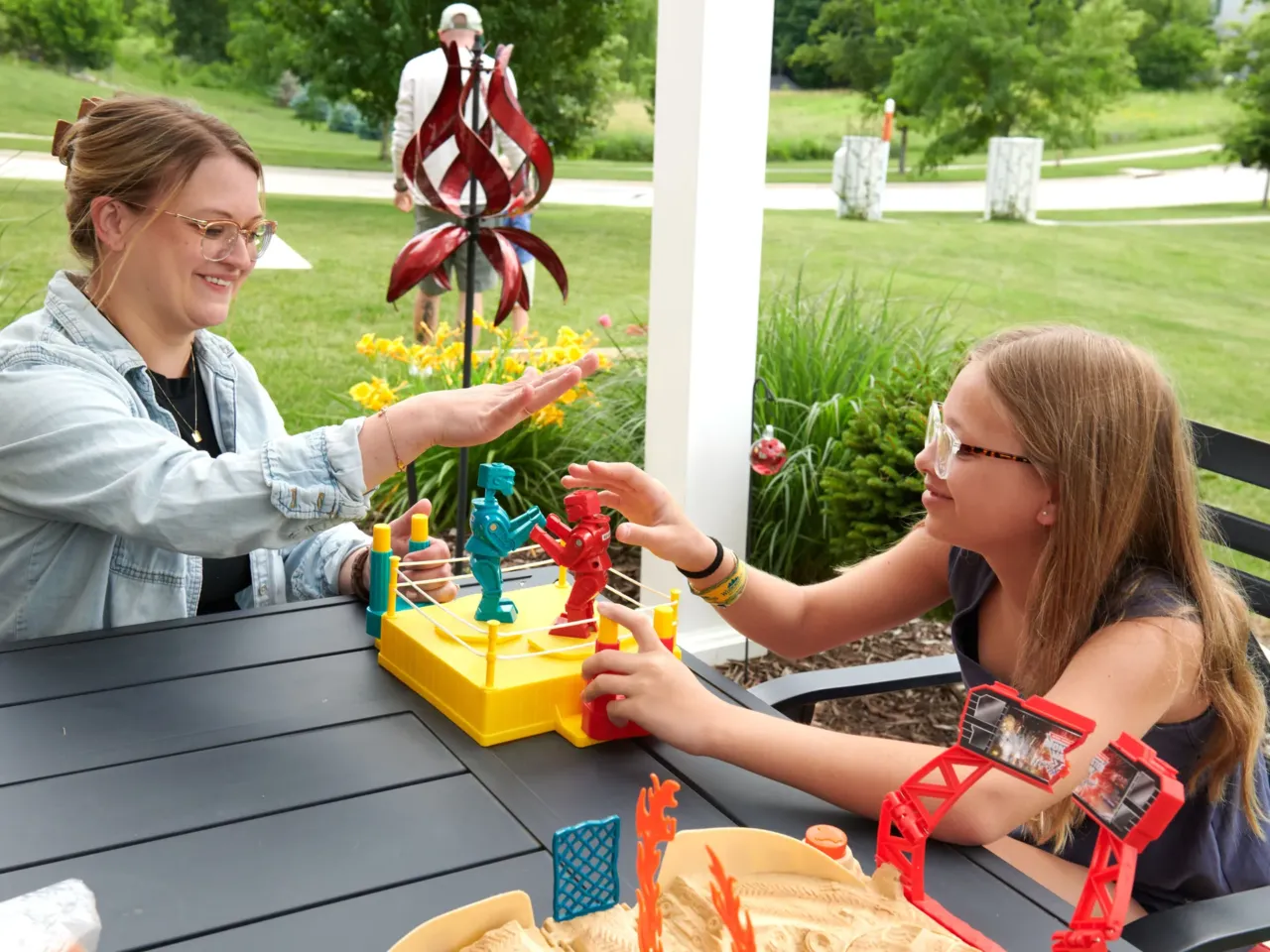 More people are juggling work and kids. Many are finding they can't give 100% to both 4 Amber Petersen and Piper, 12, play together on a patio. Amber wishes she could spend more time with her children, but the family needs two incomes.