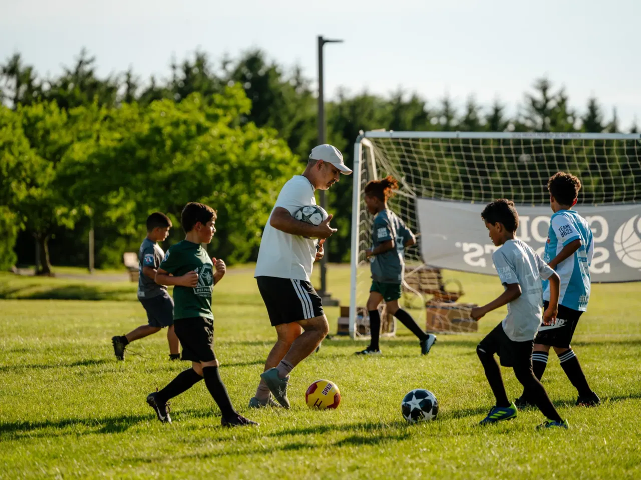 Michigan FC Director Abbas Alwishah, 44, coaches during a Michigan FC practice in Dearborn, MI. in June 2026. (Photo by Nick Hagen for NPR)