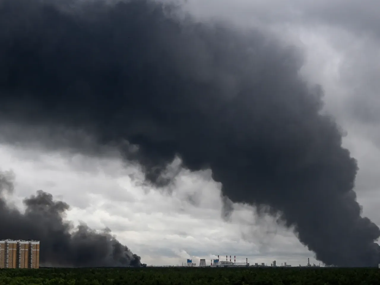 Black smoke rises from the area of the Russian oil producer Gazprom Neft's Moscow oil refinery on the outskirts of Moscow on Thursday. Moscow was fending off a "large-scale" drone attack from Ukraine, with several drones reaching an oil refinery, the city's mayor said.