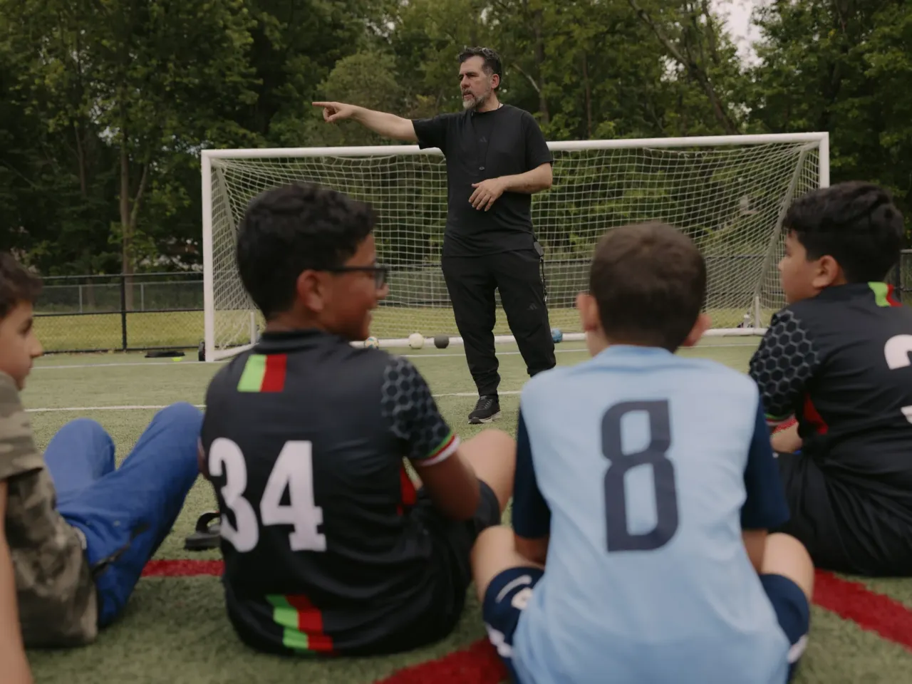 Palestinian-American kids find inspiration, and escape, on the soccer pitch 3 Coach Omar Abdulaziz leads a practice with the Palestino Soccer Academy. He says the sport gives kids a moment to detach from the realities of suffering and conflict.
