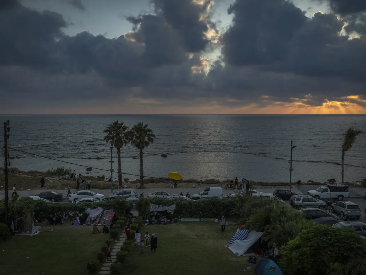 Lebanese struggle to get by in an ancient city under Israeli evacuation order 5 Displaced people sleep in the Christian area overlooking the corniche, taking shelter after evacuation warnings and destruction caused by Israeli airstrikes on residential areas in Tyre on June 7.