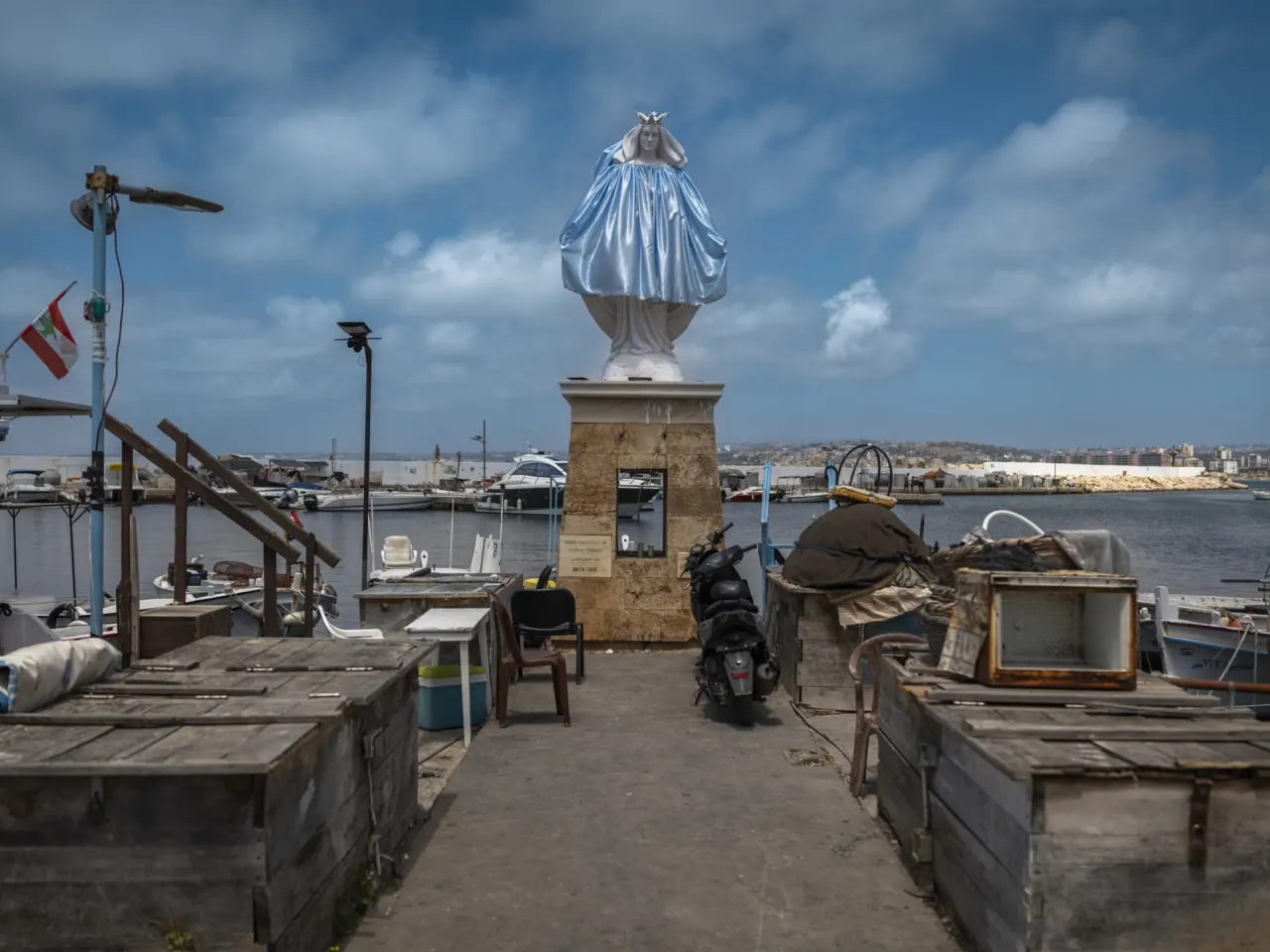Lebanese struggle to get by in an ancient city under Israeli evacuation order 6 A statue of the Virgin Mary stands in the fishing port of Tyre on June 7.