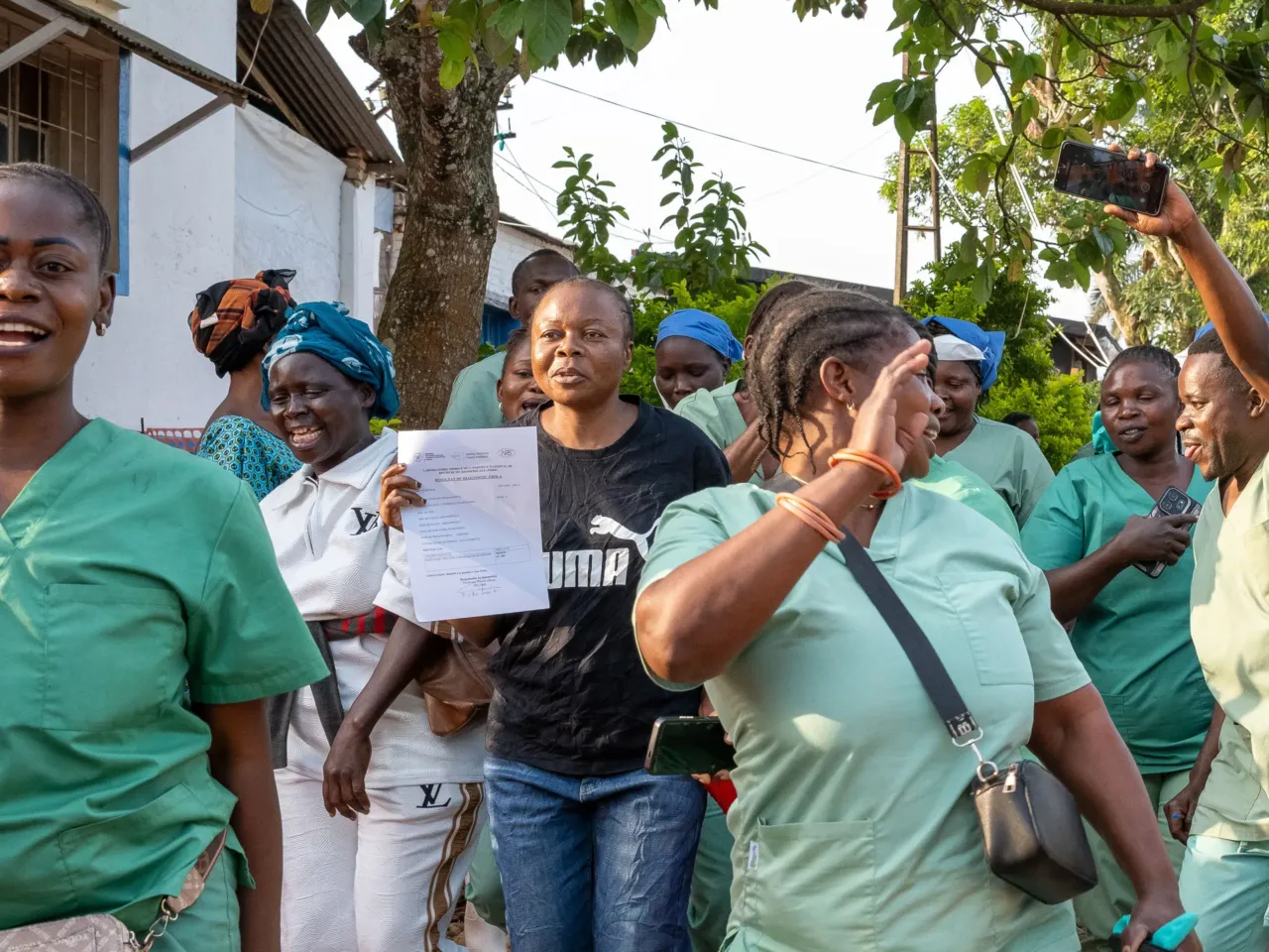 Inside the gold-mining town where the Ebola outbreak likely started 9 Healthcare workers celebrate the recovery and discharge of Ebola survivor Florence Mangembo, in blue jeans, at the Mongbwalu General Referral Hospital. She is the hospital's bookkeeper.