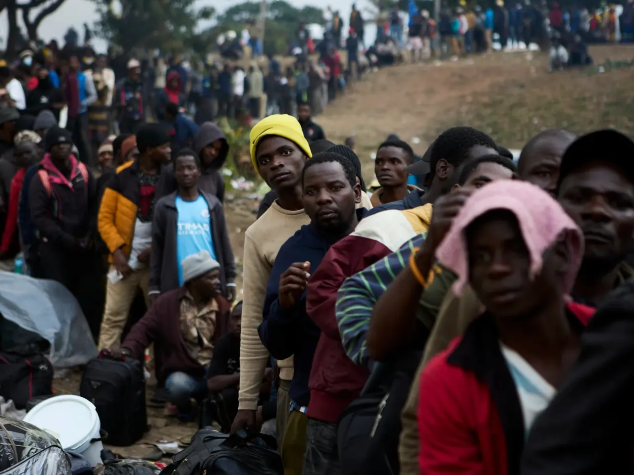 Displaced migrants queue at a deportation site in Durban, South Africa, on June 17.