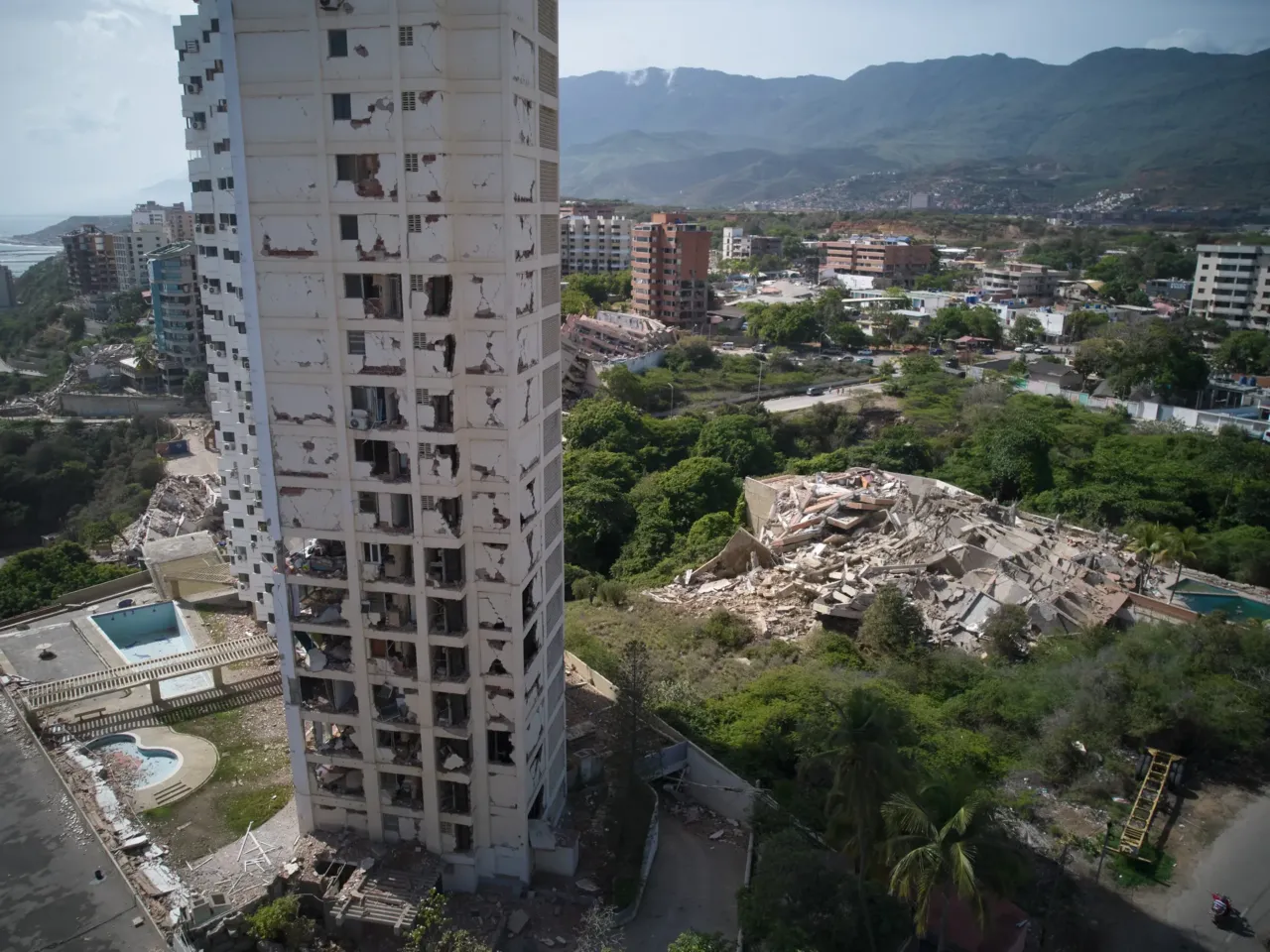 Damaged buildings stand a day after earthquakes struck La Guaira, Venezuela.