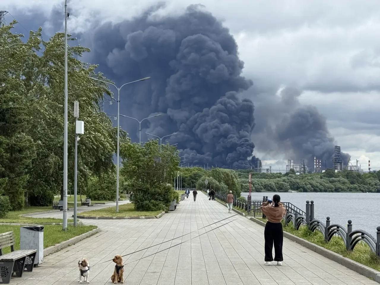 Inside a secretive Ukrainian team launching deep drone strikes at Russia 1 People walk in a park as black smoke rises from the area of the Russian oil producer Gazprom Neft's Moscow oil refinery on the southeastern outskirts of Moscow on June 18, 2026. Moscow was fending off a "large-scale" drone attack from Ukraine, with several drones reaching an oil refinery, the city's mayor Sergey Sobyanin said.
