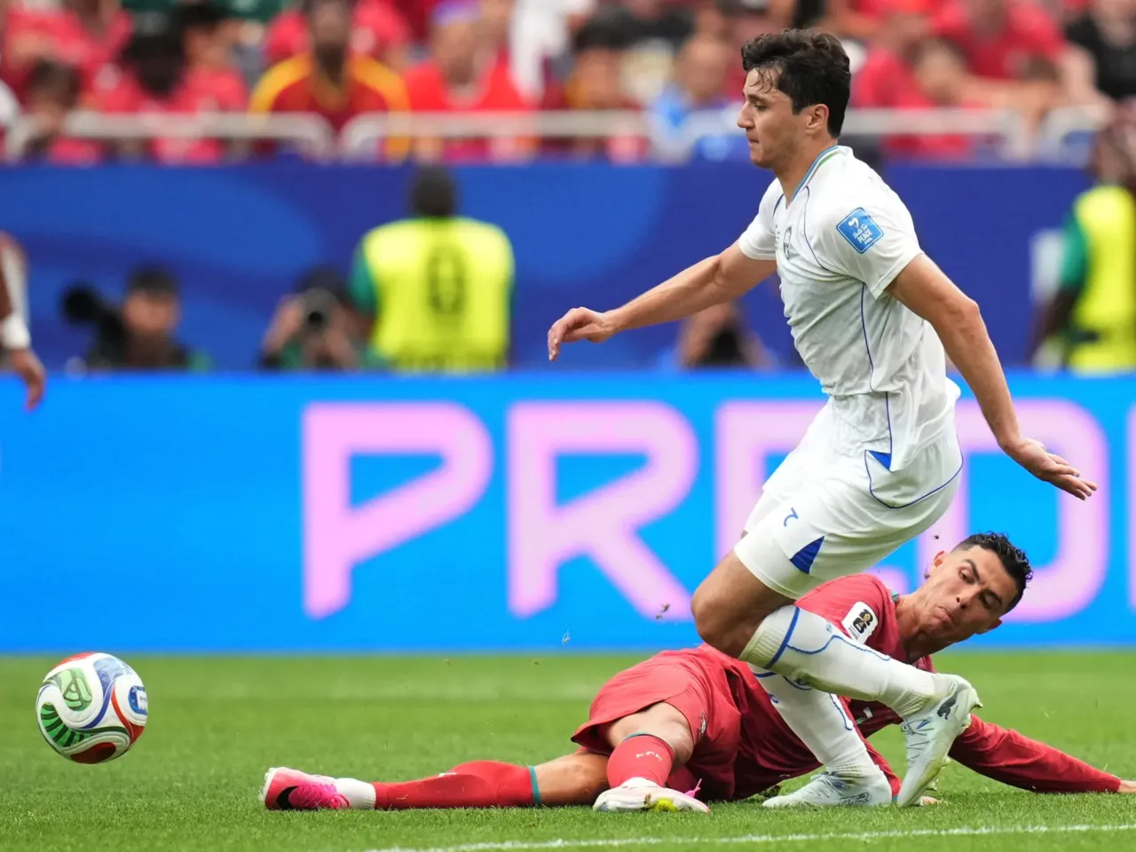 Uzbekistan makes its World Cup debut, a first for Central Asia 3 Portugal's Cristiano Ronaldo (7) challenges for the ball with Uzbekistan's Abdukodir Khusanov (2) during the World Cup Group K soccer match between Portugal and Uzbekistan in Houston, June 23.