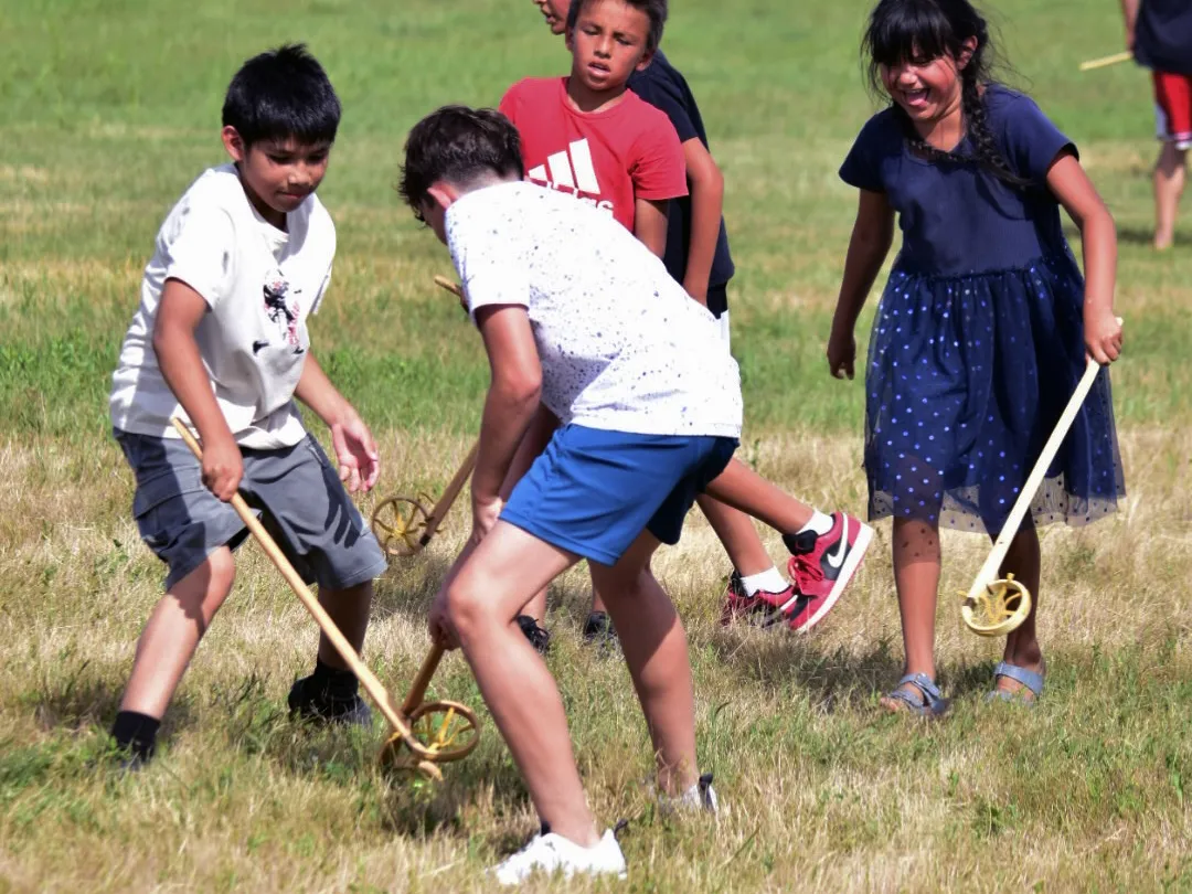 Native Americans celebrate victory at the Battle of Little Bighorn, 150 years later 5 A group of children from different tribal nations play lacrosse together using traditional equipment.