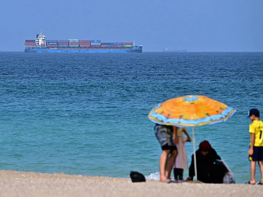 Trump says the U.S. and Iran will meet in Qatar after weekend attacks 1 A cargo ship is pictured off coast of the Khor Fakkan Container Terminal, the only natural deep-sea port in the region and one of the major container ports in Sharjah Emirate, along the Gulf of Oman on Sunday.