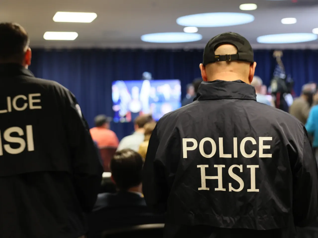 He sent a harsh email to ICE's top official. 5 months later, federal agents tracked him down 5 Members of Homeland Security Investigations listen as FBI Director Kash Patel speaks during a press conference on Oct. 23, 2025 in New York City.