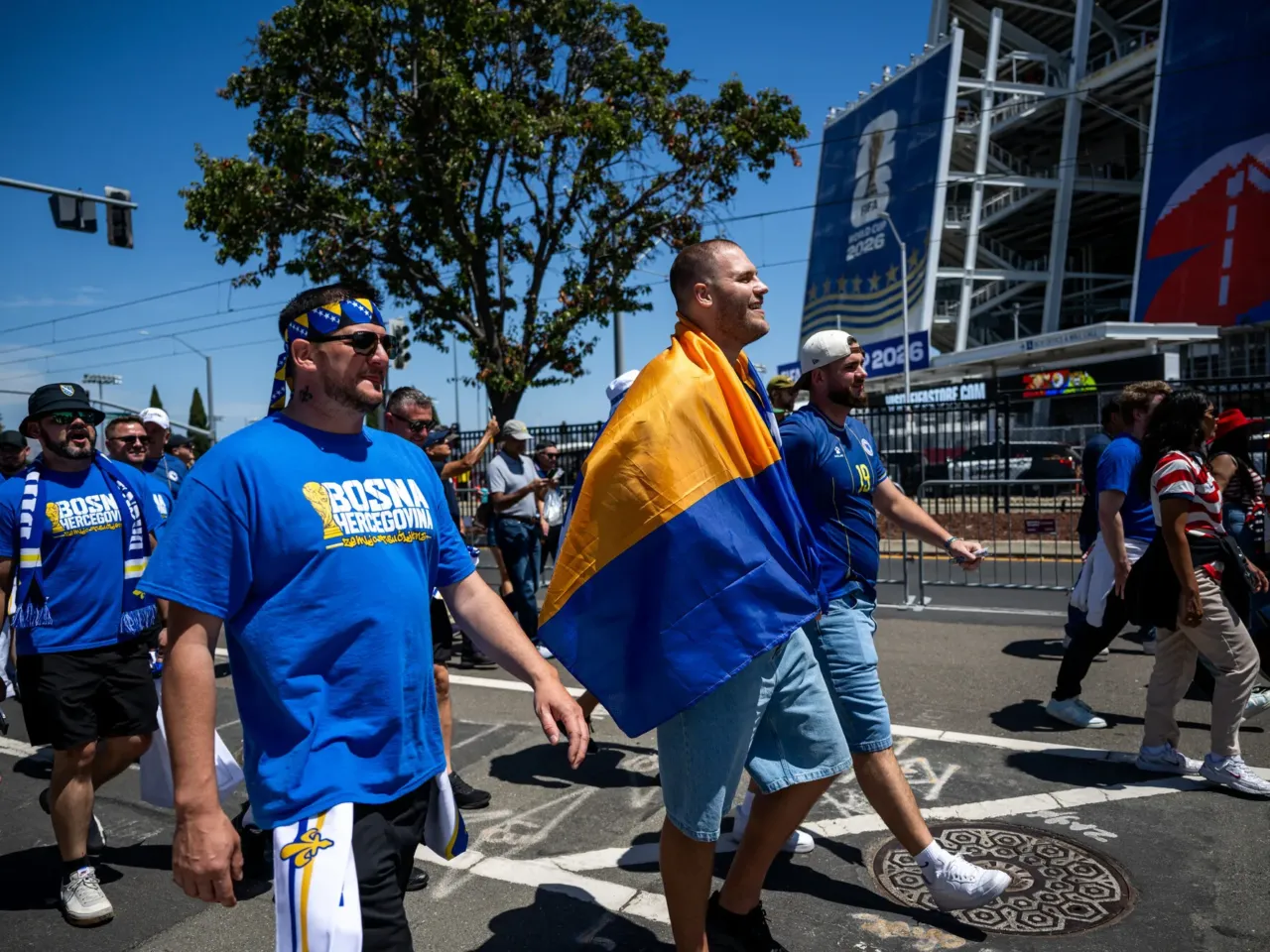 Fans of Bosnia-Herzegovina walk toward the San Francisco Bay Area stadium ahead of the game.