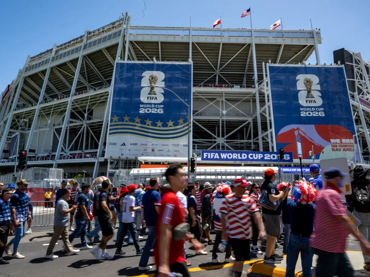 Fans walk toward the San Francisco Bay Area stadium ahead of the game.