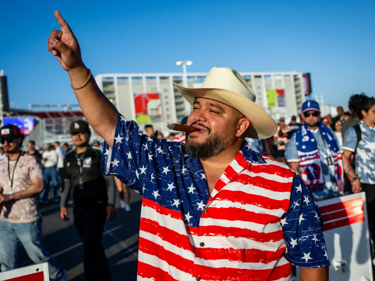 Naseem Farooqi celebrates the U.S. team victory as he leaves the stadium in Santa Clara.
