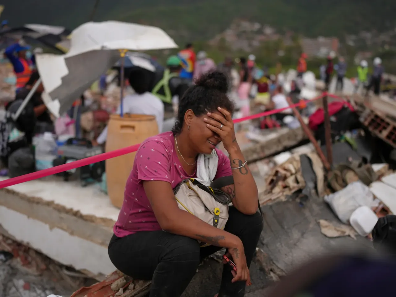 'We can still pull out live victims': LA rescuers join Venezuela quake rescue efforts 2 Khaterine Roa cries as members of the Los Angeles County Fire Department search for survivors at a building that collapsed during the earthquakes that struck La Guaira, Venezuela, Tuesday.