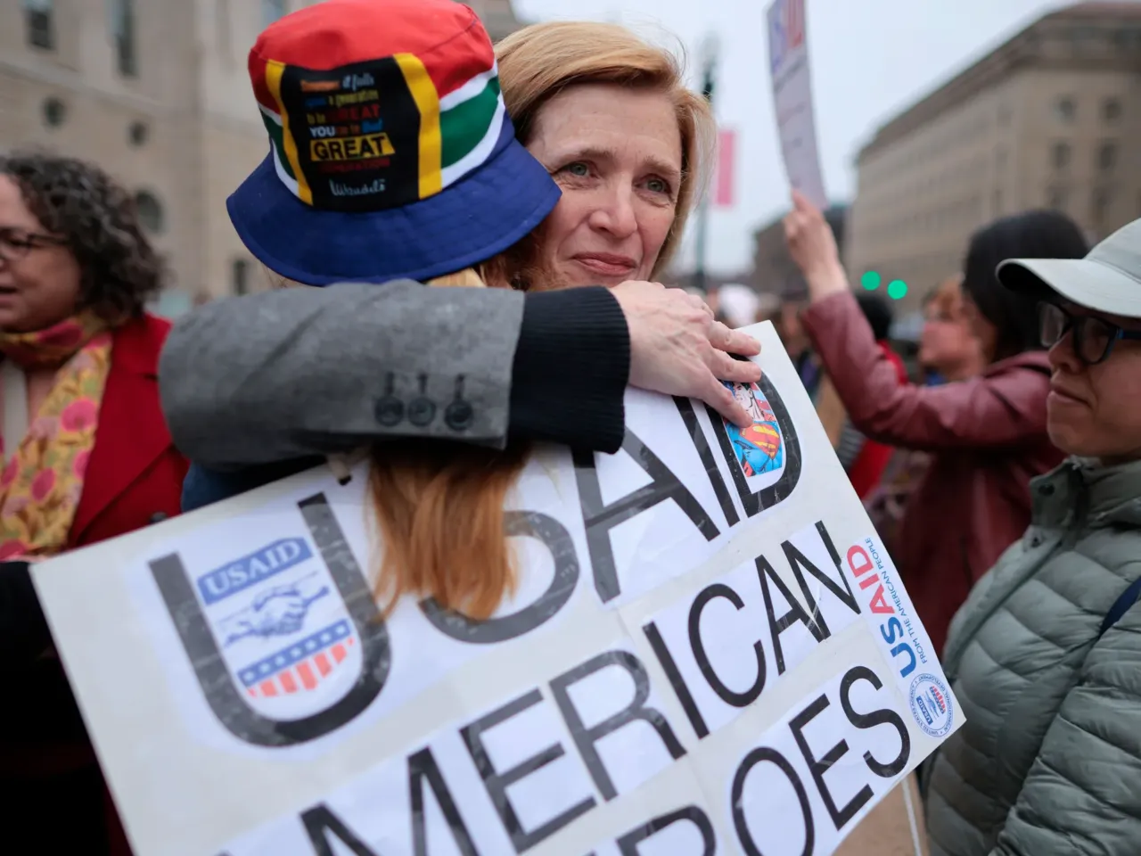 Ambassador Samantha Power (C), former head of the United States Agency for International Development (USAID), embraces fired employees and their supporters outside the agency's headquarters on February 27, 2025 in Washington, D.C.