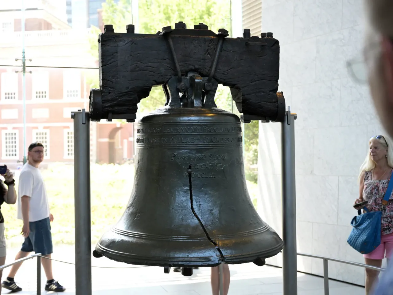 People visit the Liberty Bell on the eve of Independence Day in Philadelphia on July 3, 2025. The crack in this symbol of U.S. freedom echoes the paradox between national pride and civic ignorance revealed in a new national poll.