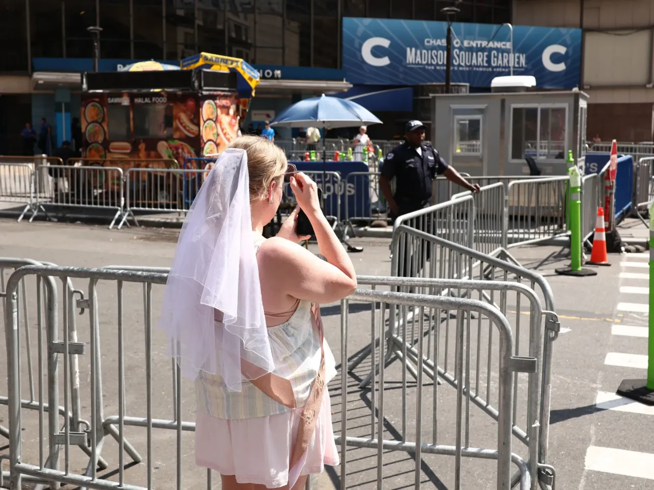 After weeks of speculation, Taylor Swift, Travis Kelce wed in New York 2 A woman wearing a white veil stands outside Madison Square Garden in New York City on July 3, 2026. Taylor Swift and Travis Kelce's official wedding plans are tightly under wraps, but New York is bracing to host the celebrity marriage of the year.